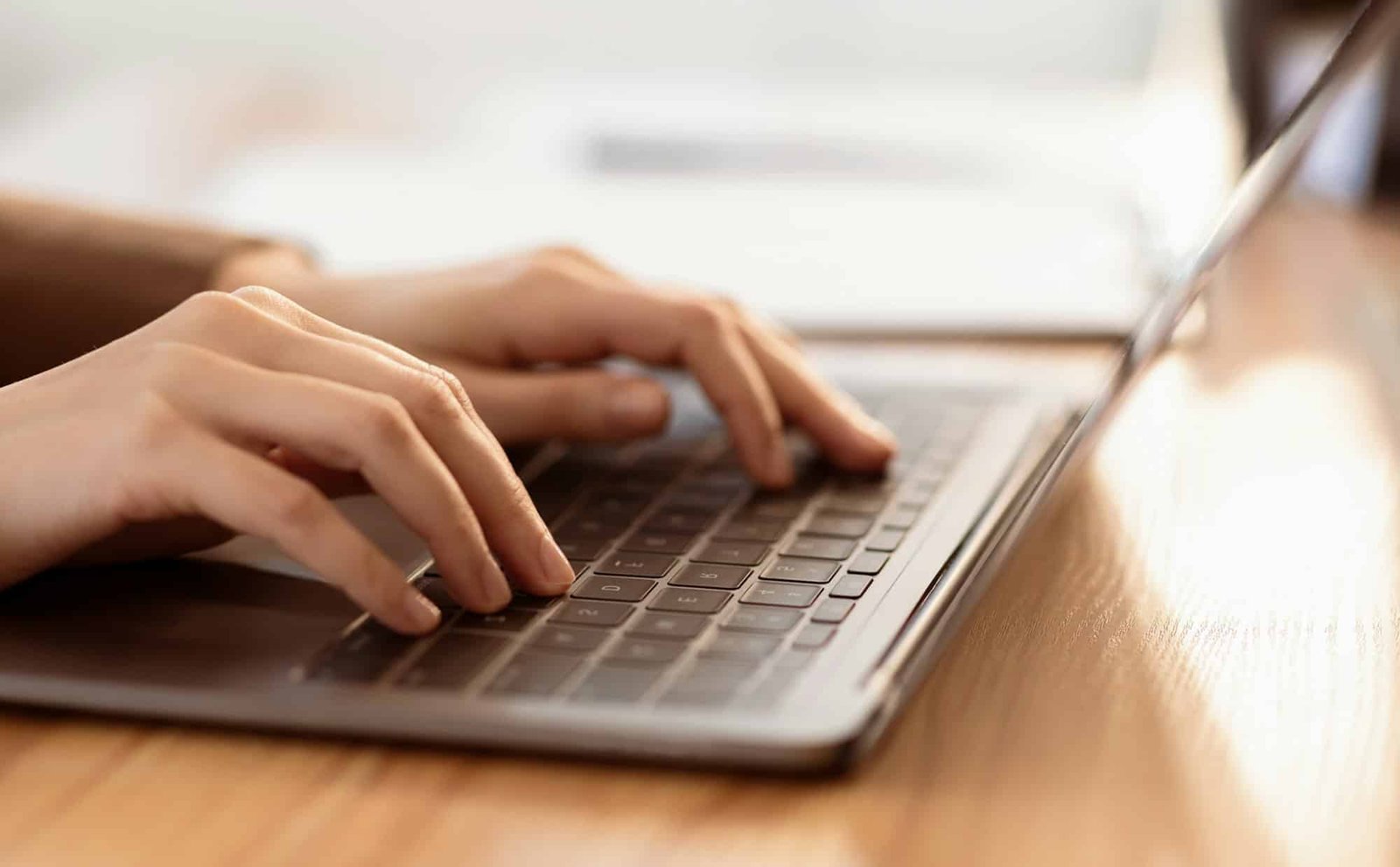 Cropped image of manager using laptop computer