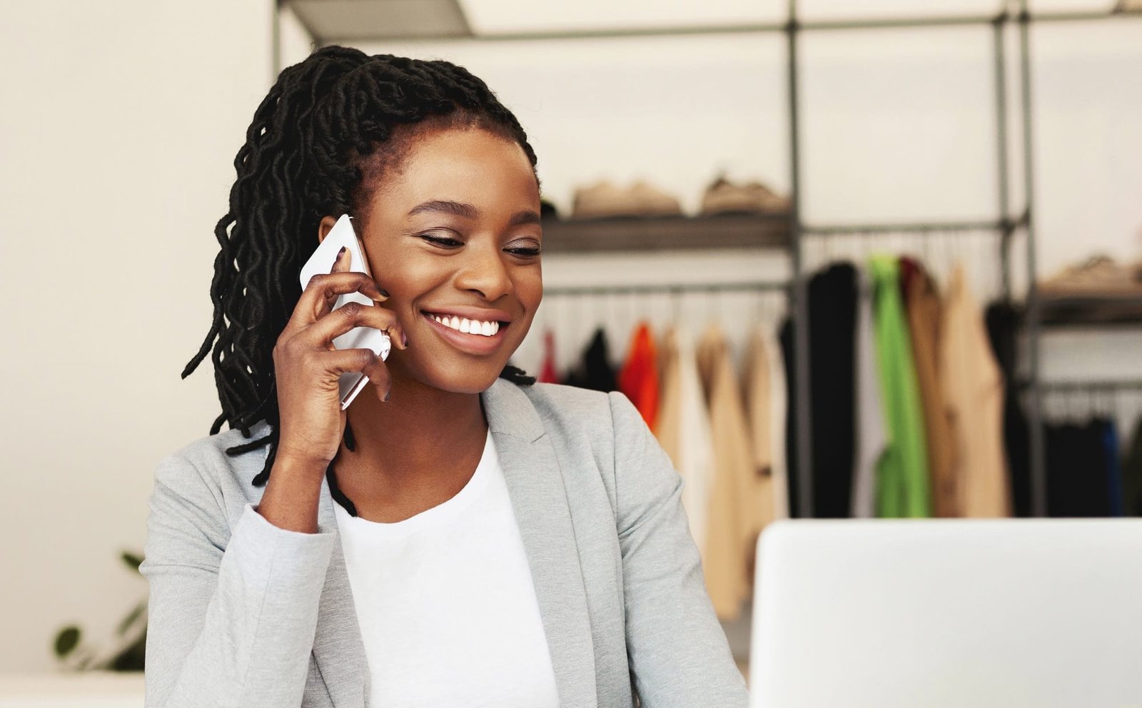Communication with suppliers. Woman tailor talking on phone